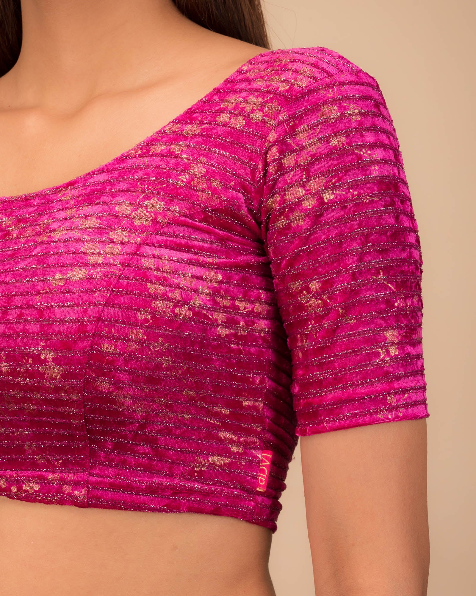 Close-up of the velvet fabric with metallic foil accents.