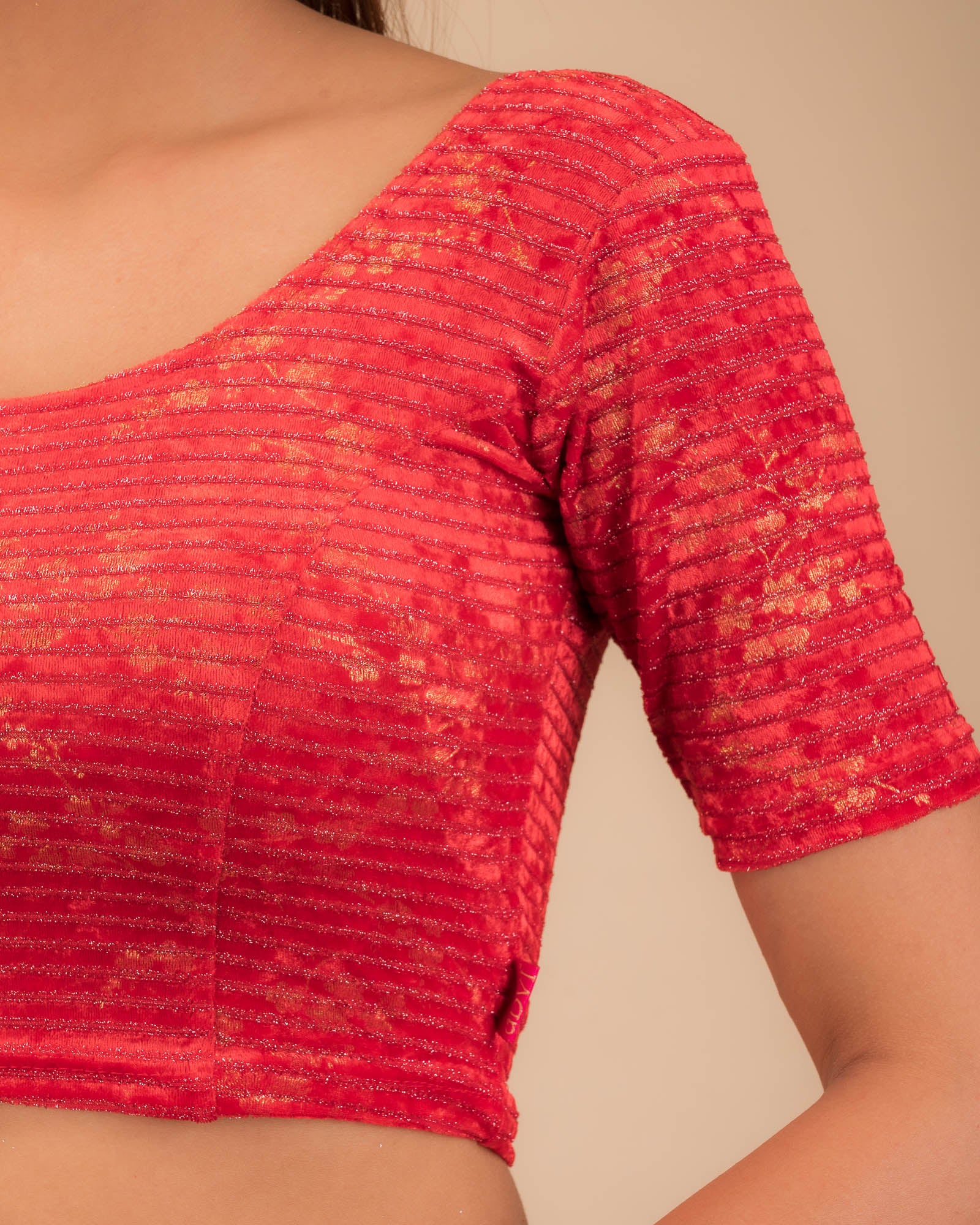 Close-up of the velvet fabric with metallic foil accents.