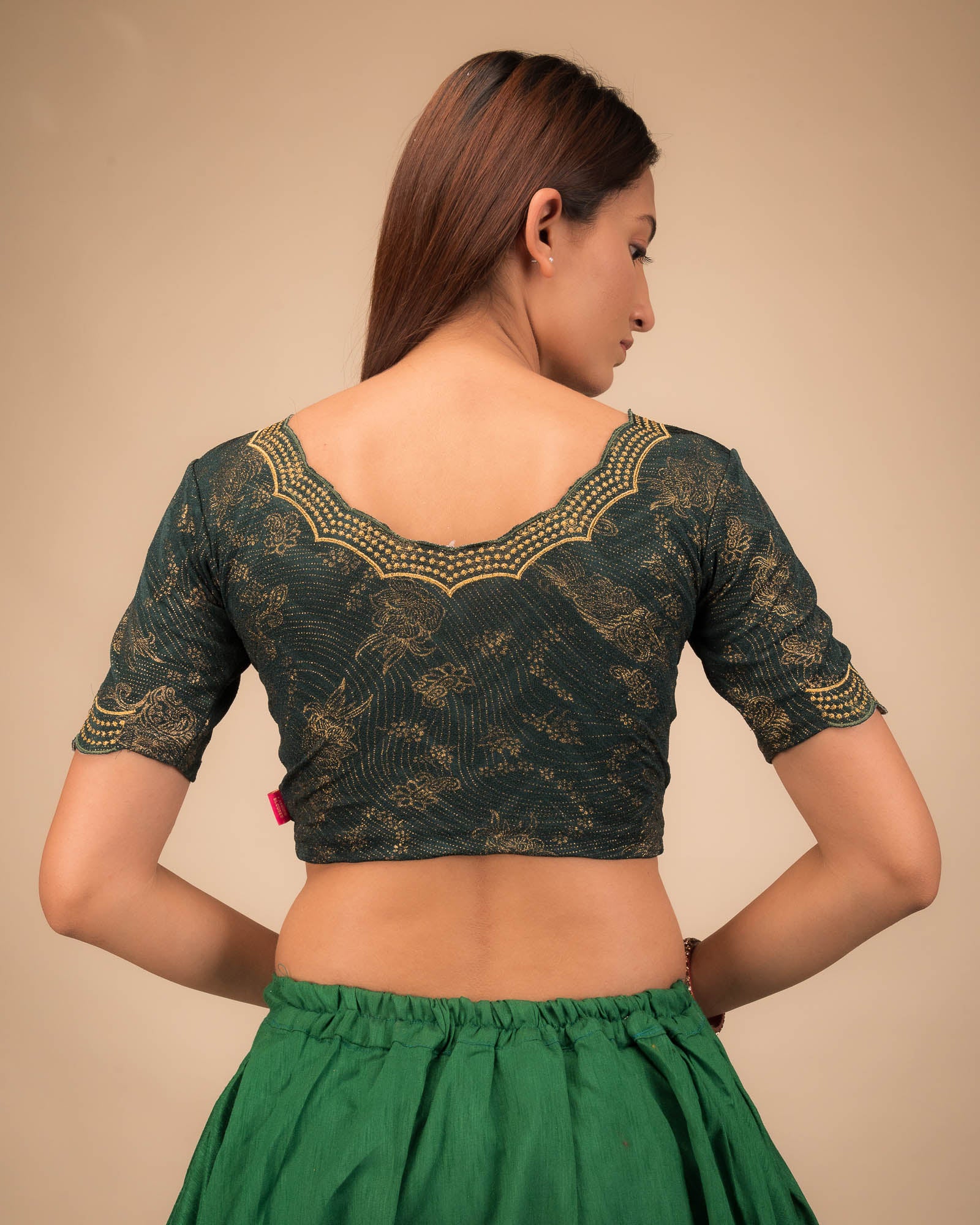 Rear view showcasing the blouse’s back design.