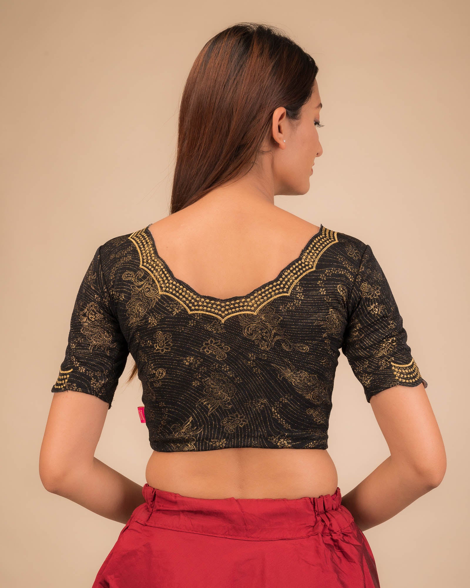 Rear view showcasing the blouse’s back design.