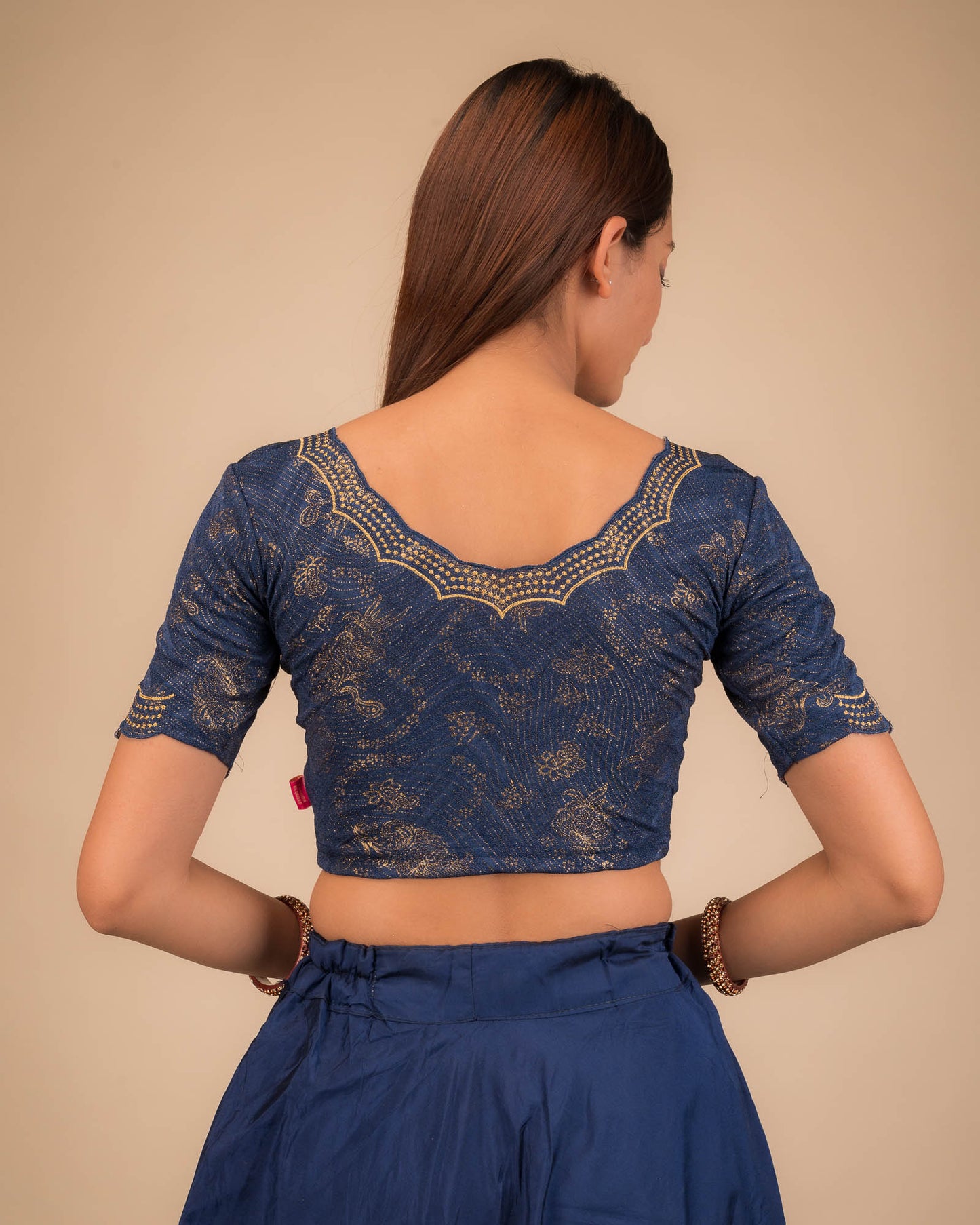 Rear view showcasing the blouse’s back design.