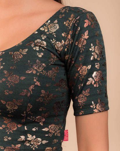 Close-up of the textured fabric with foil floral detailing.