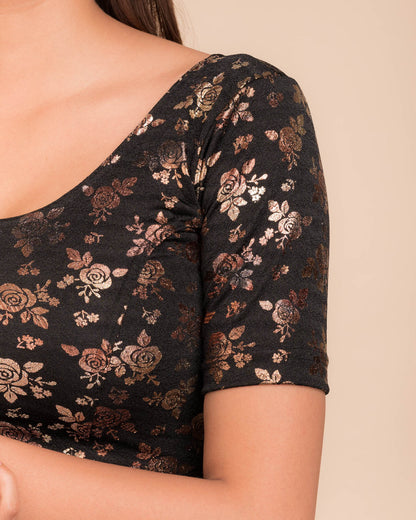 Close-up of the textured fabric with foil floral detailing.