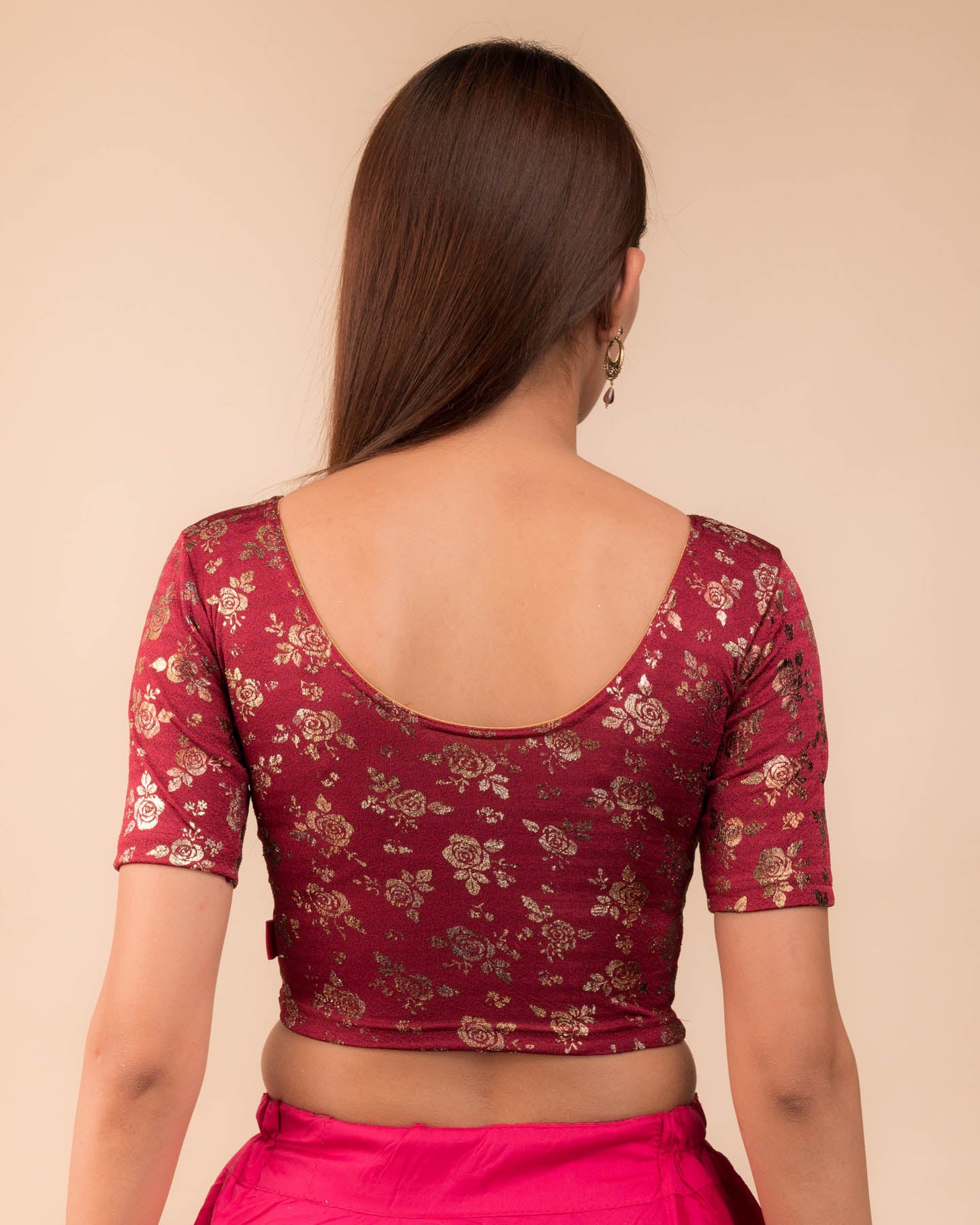 Rear view showcasing the blouse’s back design.