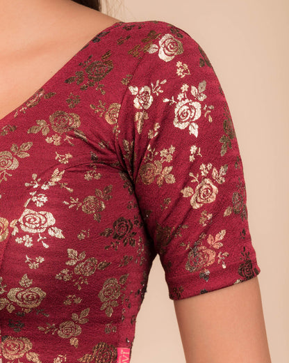 Close-up of the textured fabric with foil floral detailing.