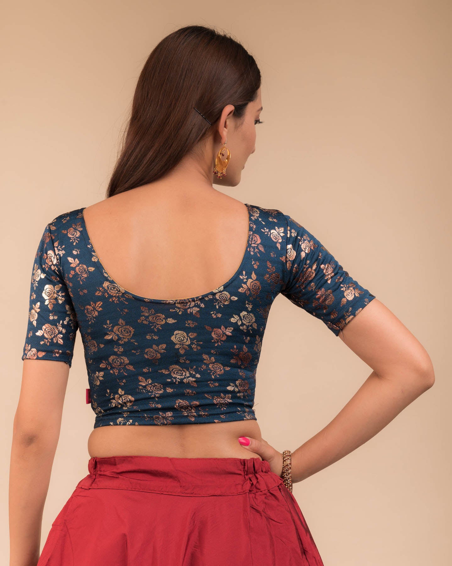Rear view showcasing the blouse’s back design.