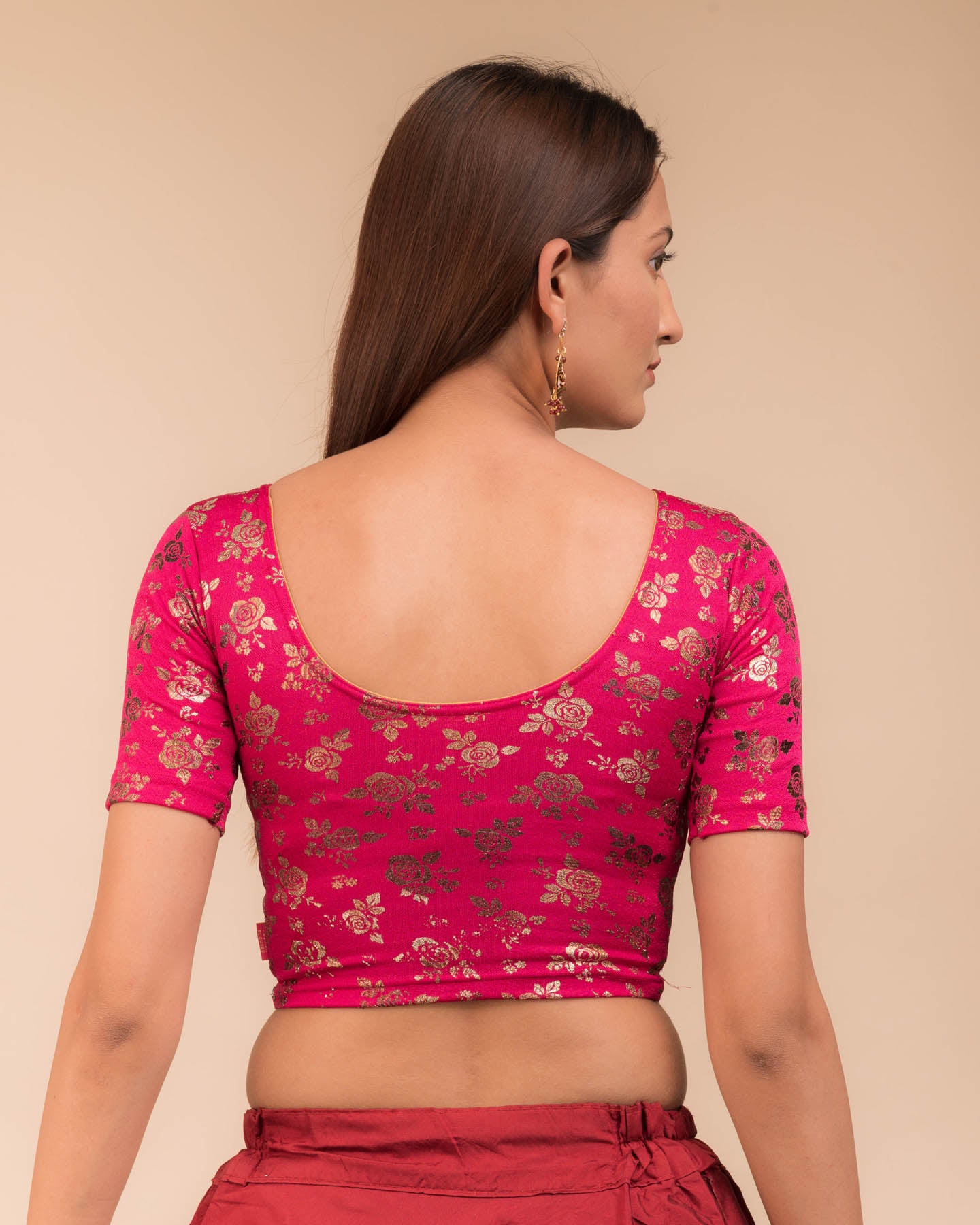 Rear view showcasing the blouse’s back design.
