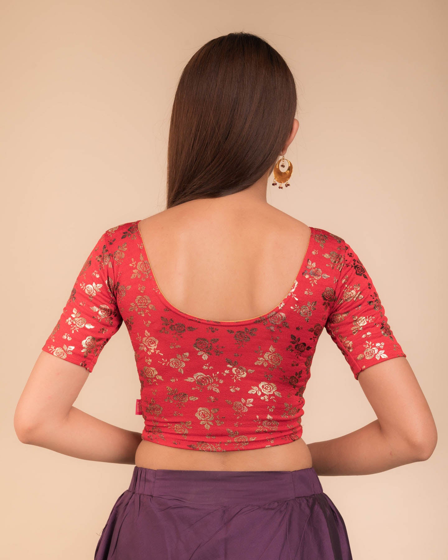 Rear view showcasing the blouse’s back design.