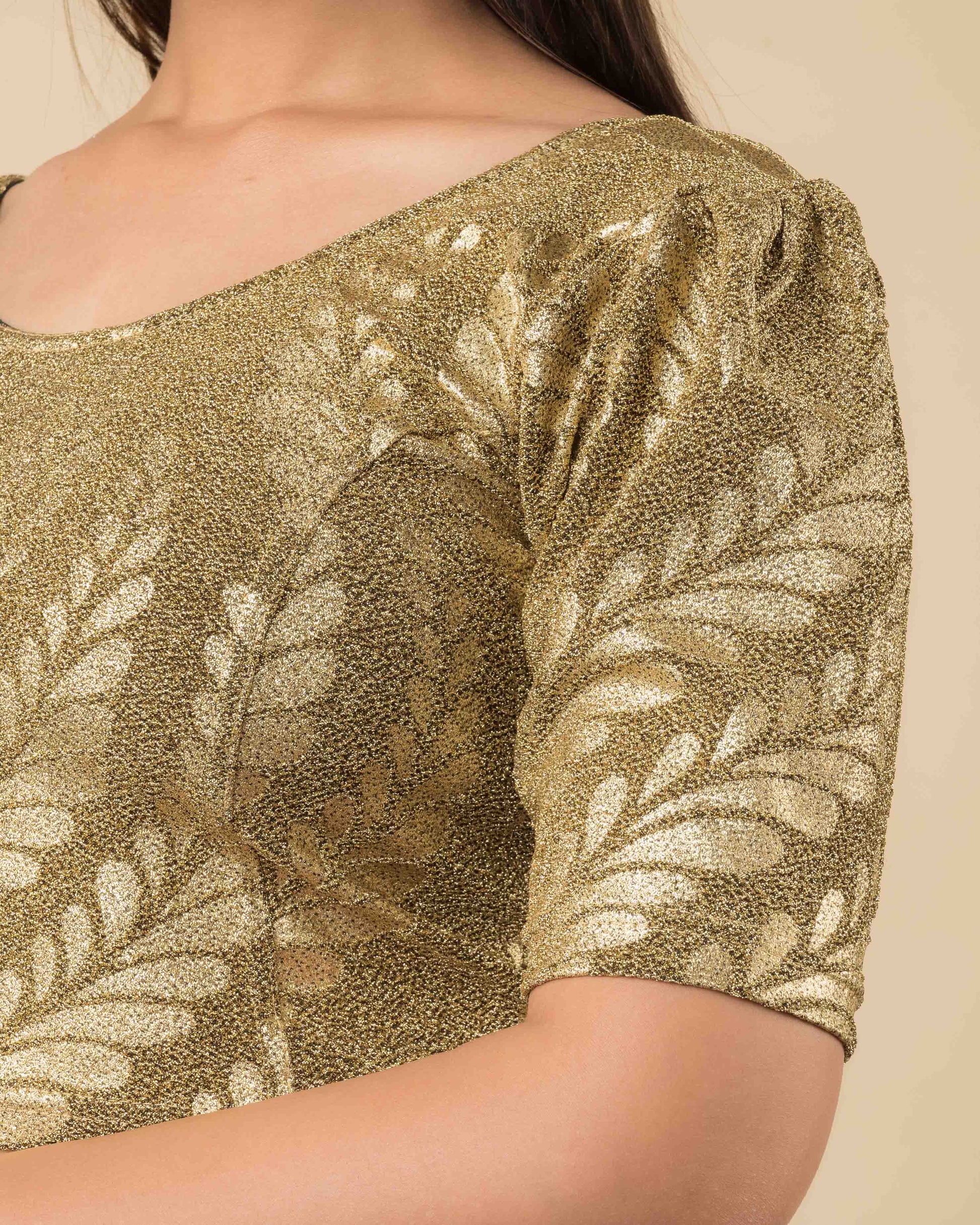 Close-up of the metallic jacquard fabric showing embossed detailing.