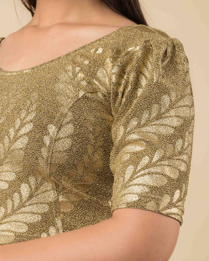 Close-up of the metallic jacquard fabric showing embossed detailing.