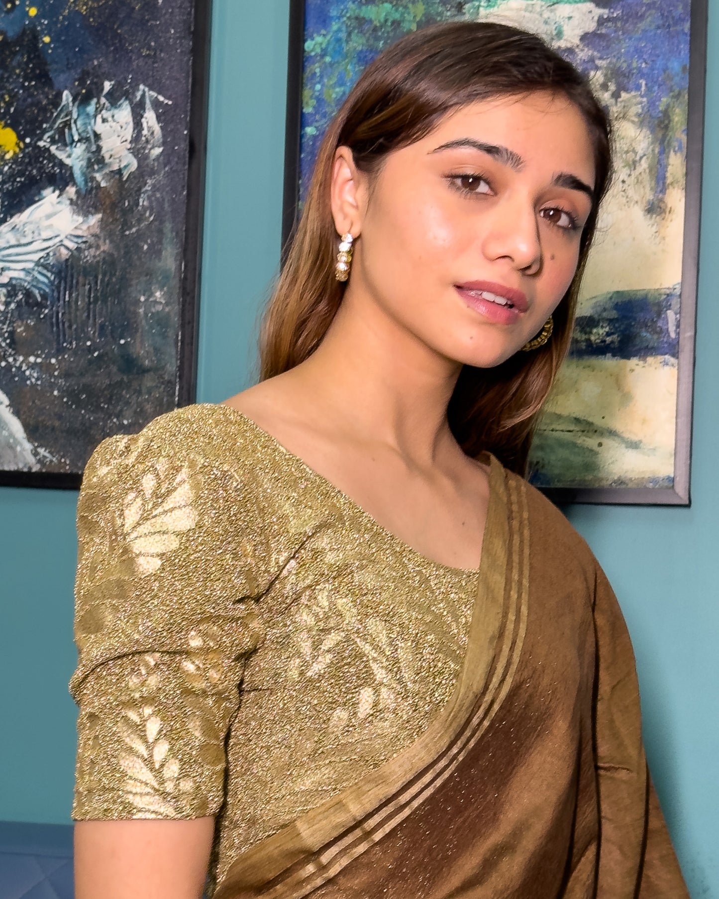 Blouse paired with a traditional saree, creating an ethnic festive look.