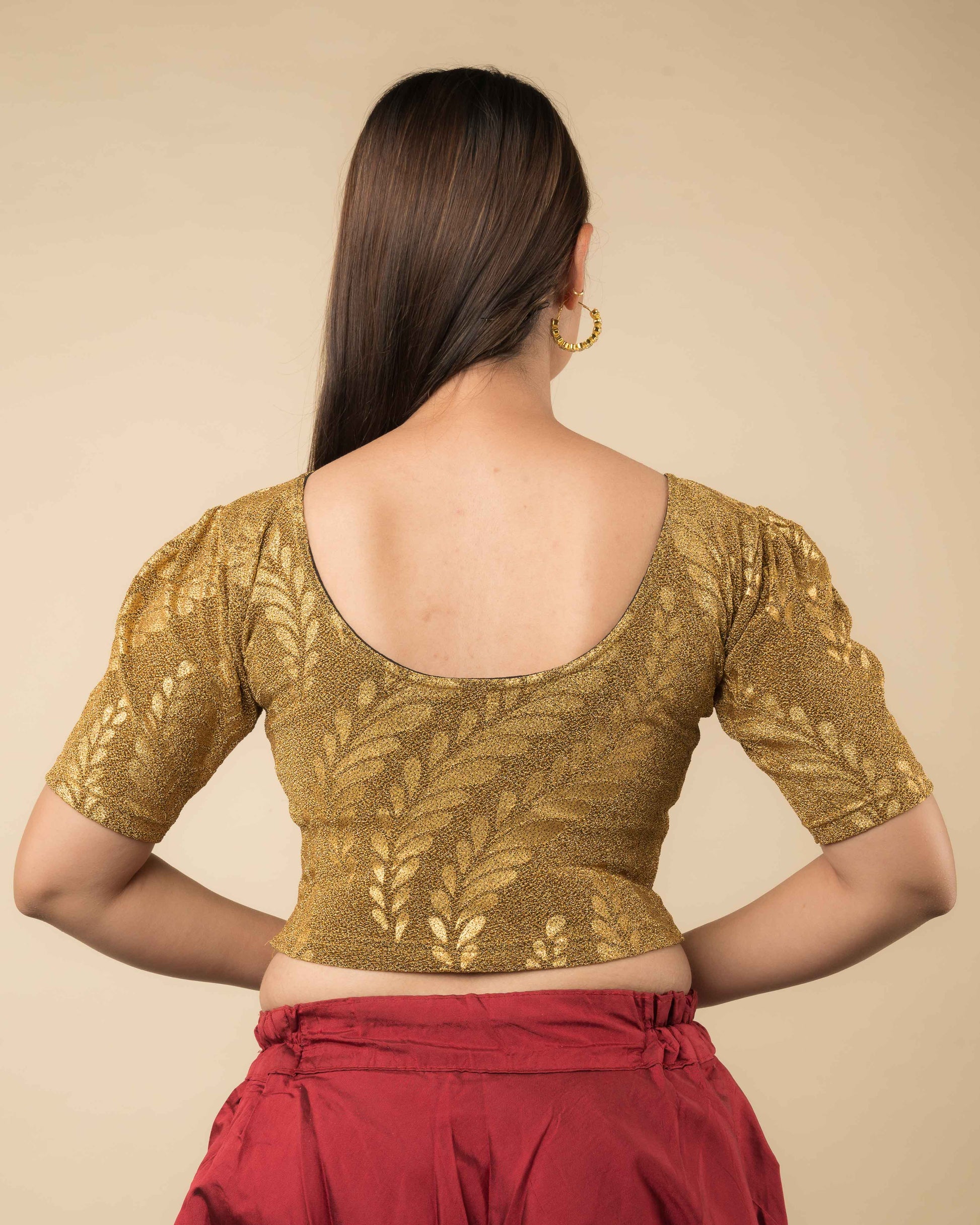 Rear view of metallic zari blouse with rose print showing fit and rose pattern detailing.