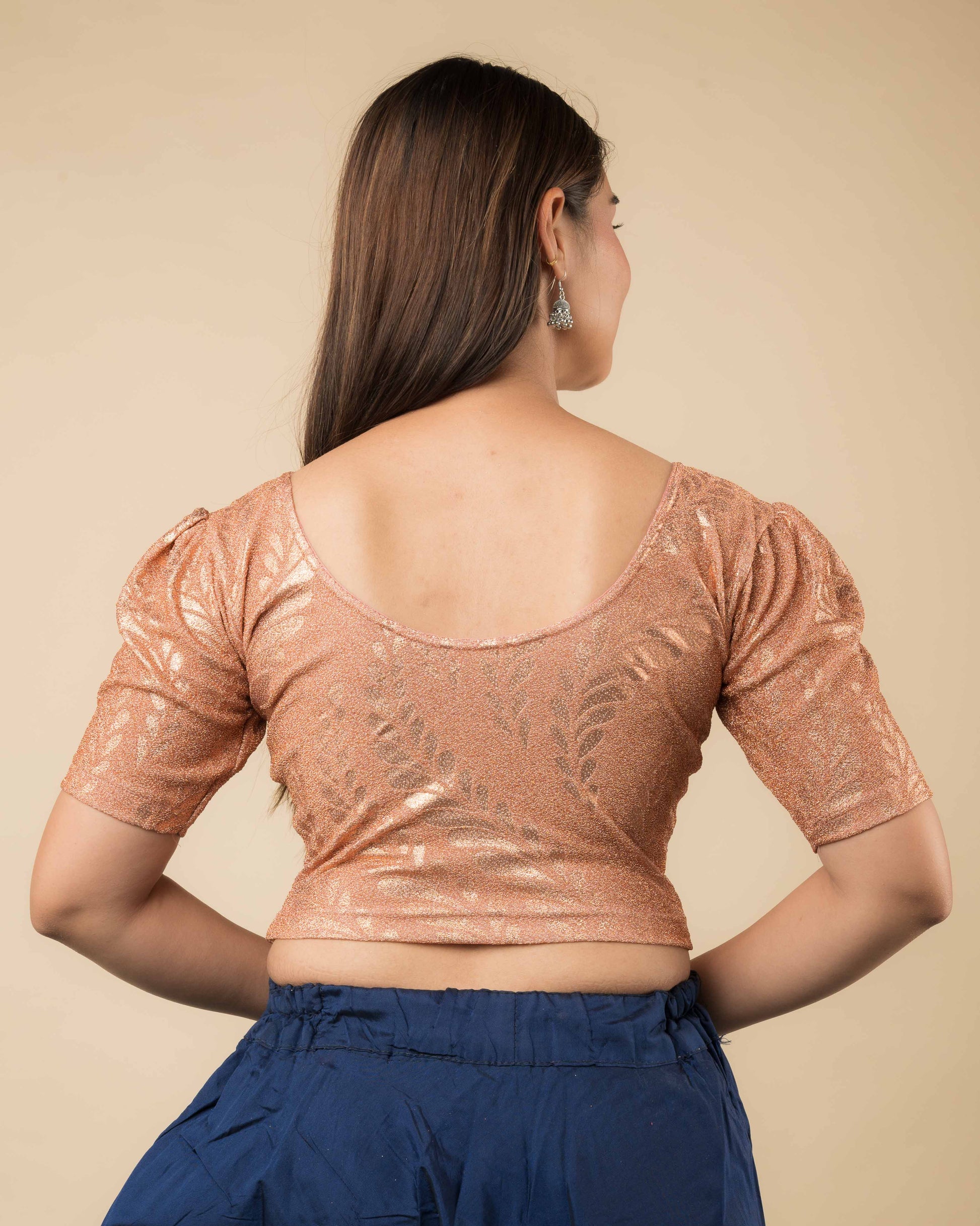 Rear view of metallic zari blouse with rose print showing fit and rose pattern detailing.