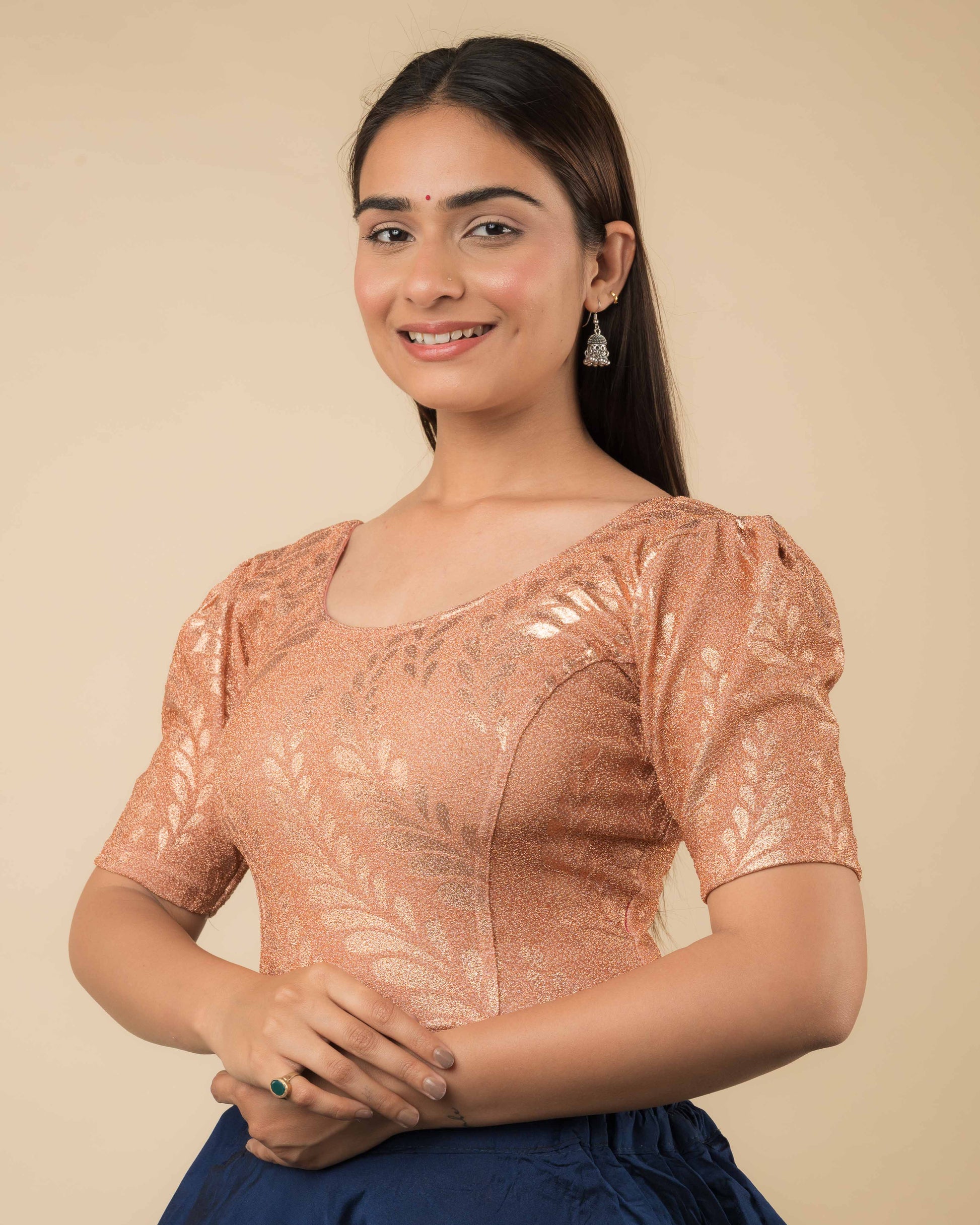 Side profile of metallic zari stretchable blouse highlighting fit, rose print design, and sleeve structure.