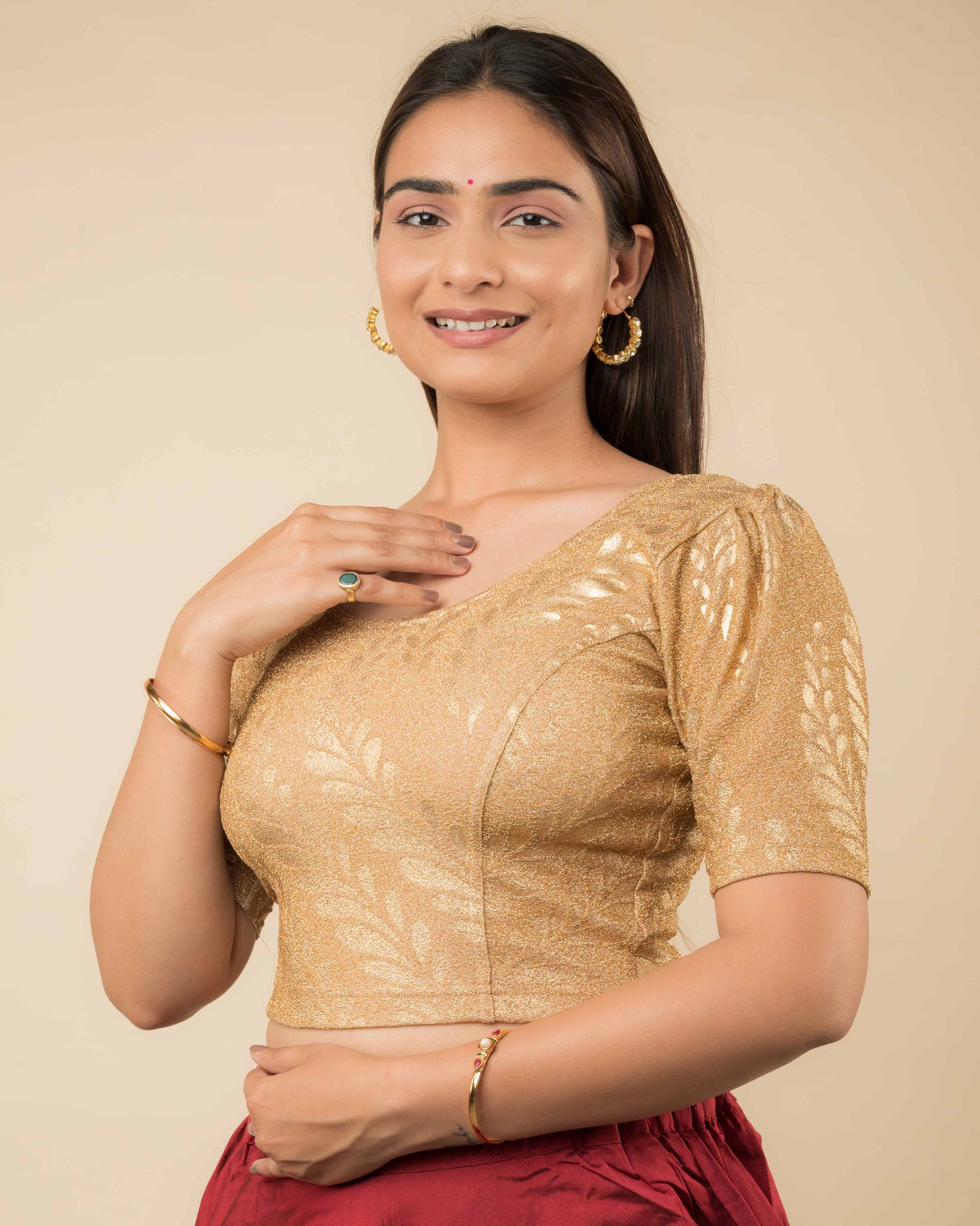 Side profile of metallic zari stretchable blouse highlighting fit, rose print design, and sleeve structure.