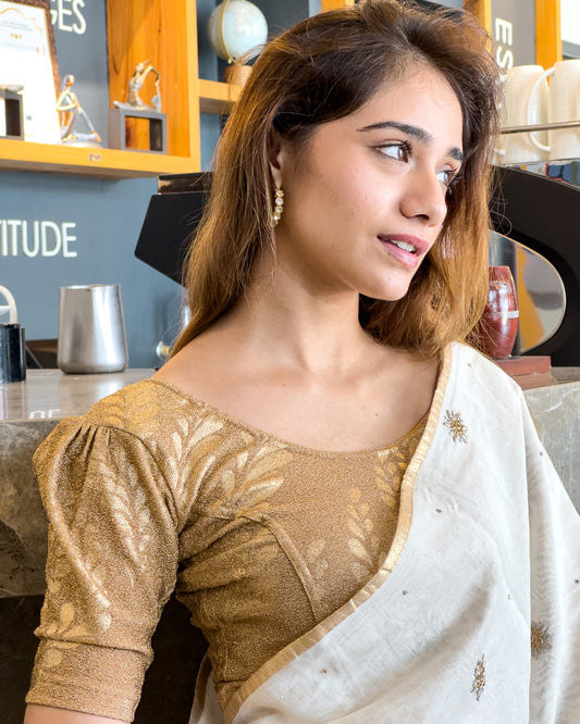 Model pairing metallic zari stretchable blouse with saree for a festive ethnic look.
