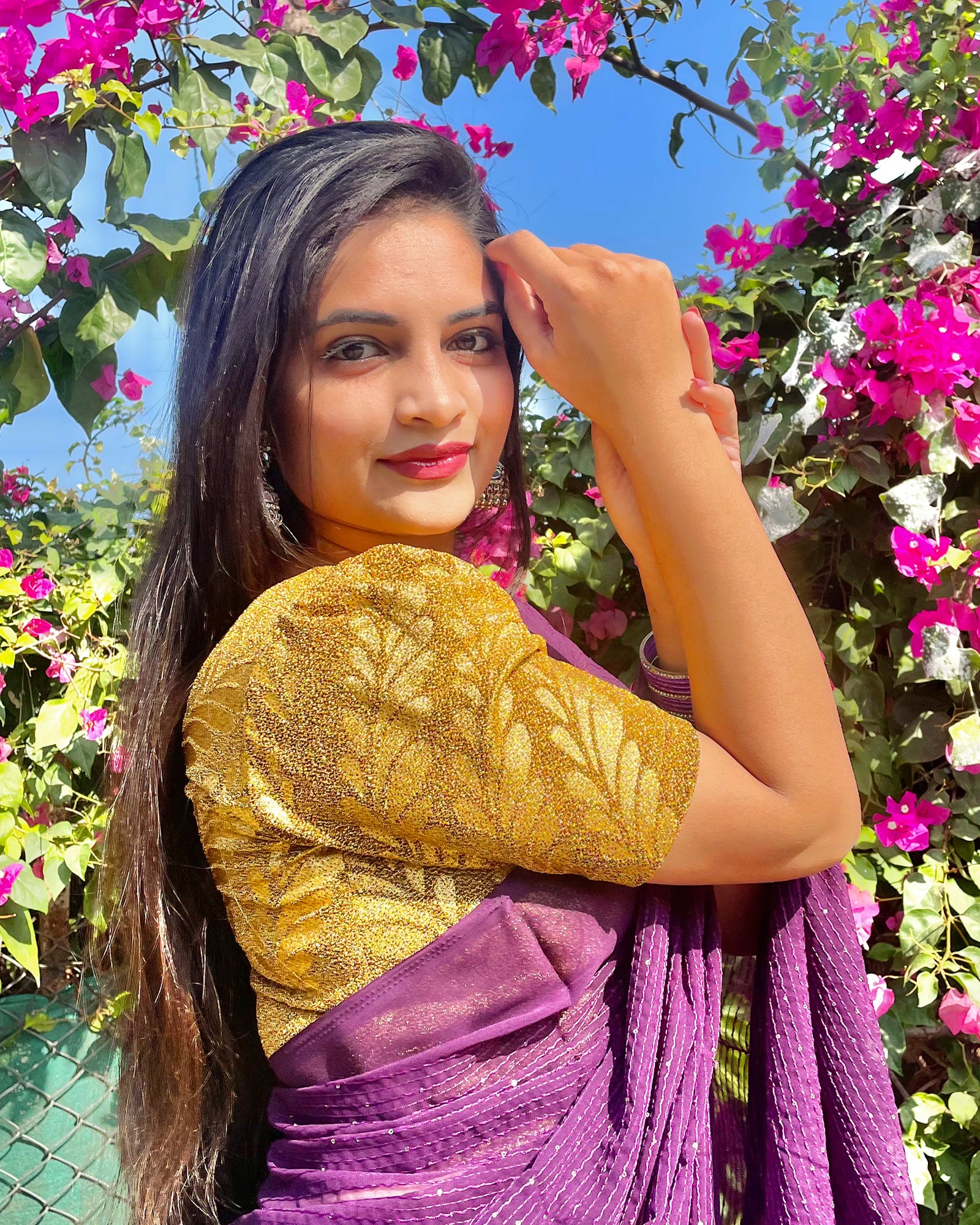 Model pairing metallic zari stretchable blouse with saree for a festive ethnic look.