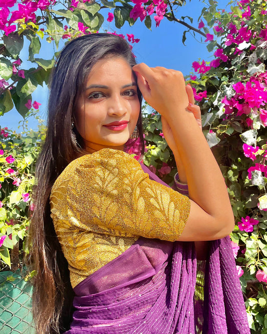 Model pairing metallic zari stretchable blouse with saree for a festive ethnic look.