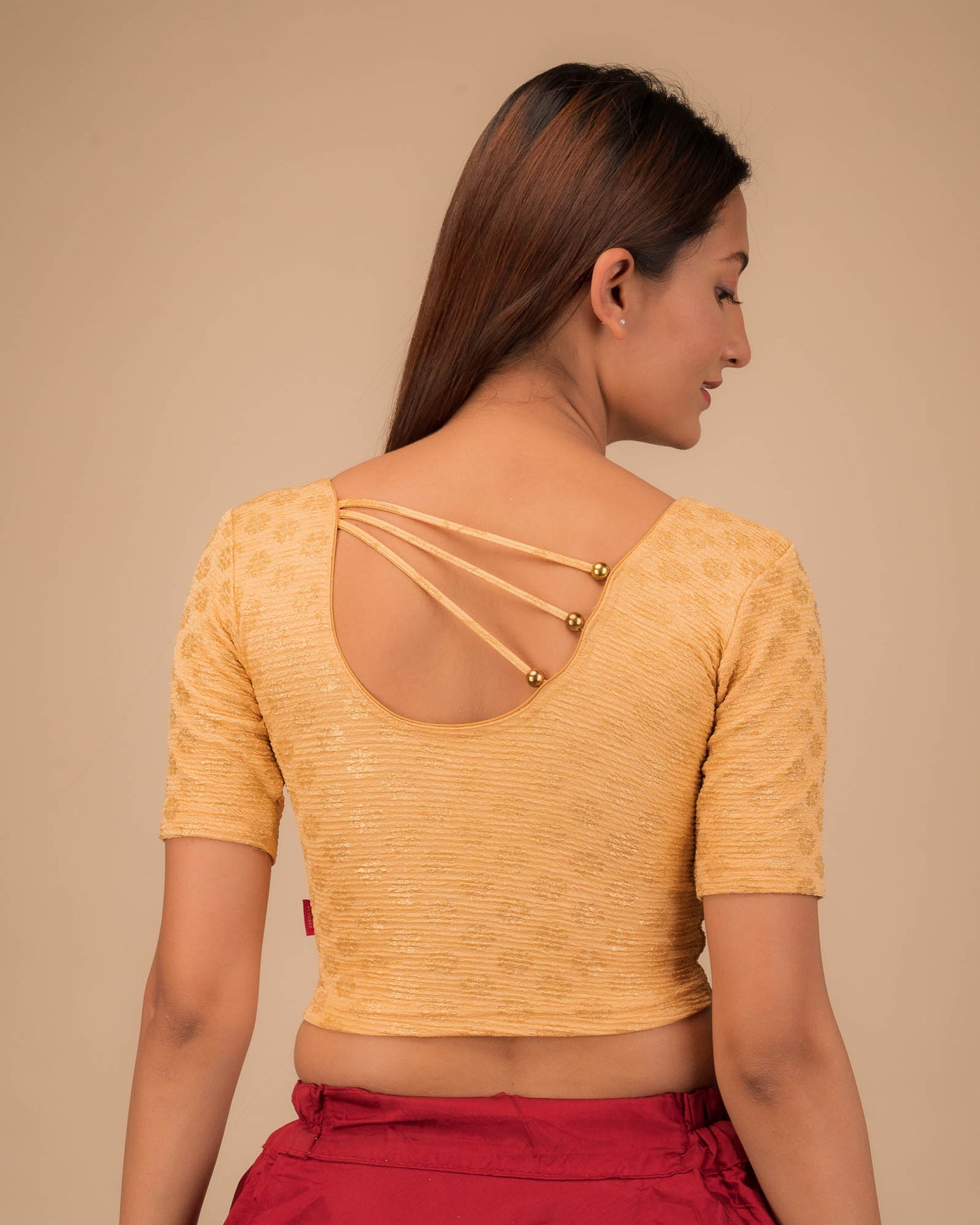 Rear view showcasing pearl accents at the back.