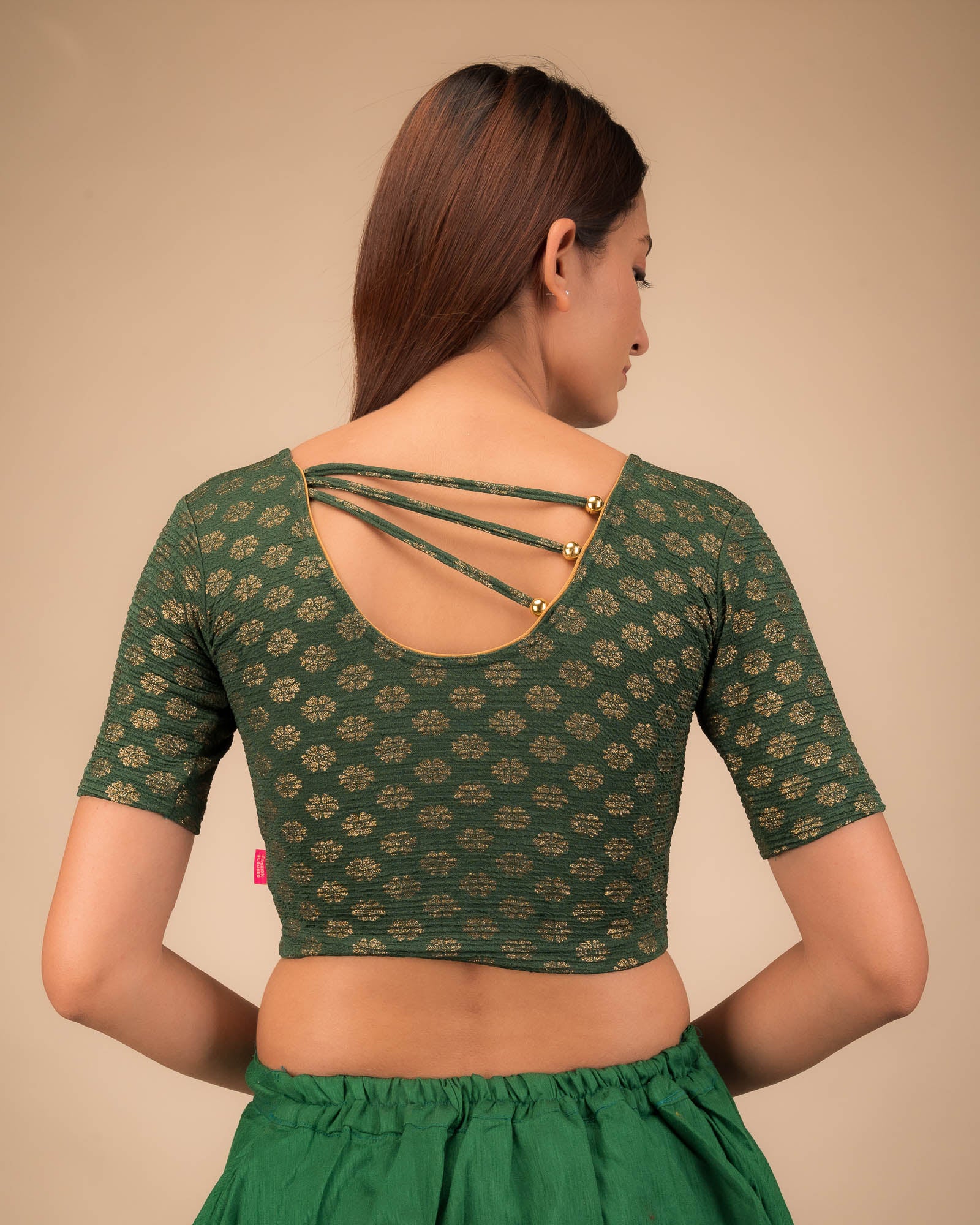 Rear view showcasing pearl accents at the back.