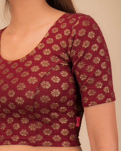 Close-up of jacquard knit with foil floral pattern.