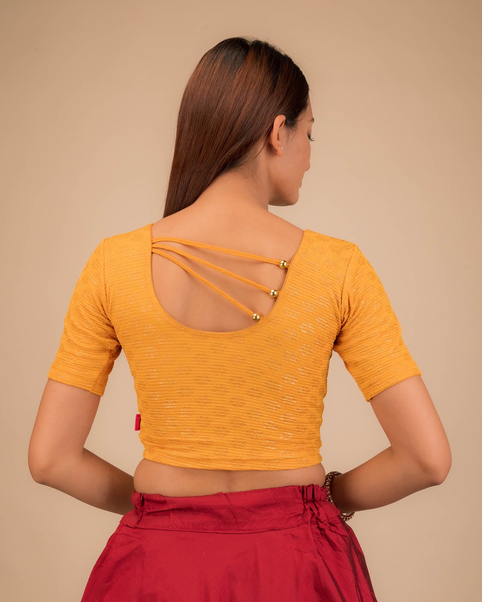 Rear view showcasing pearl accents at the back.