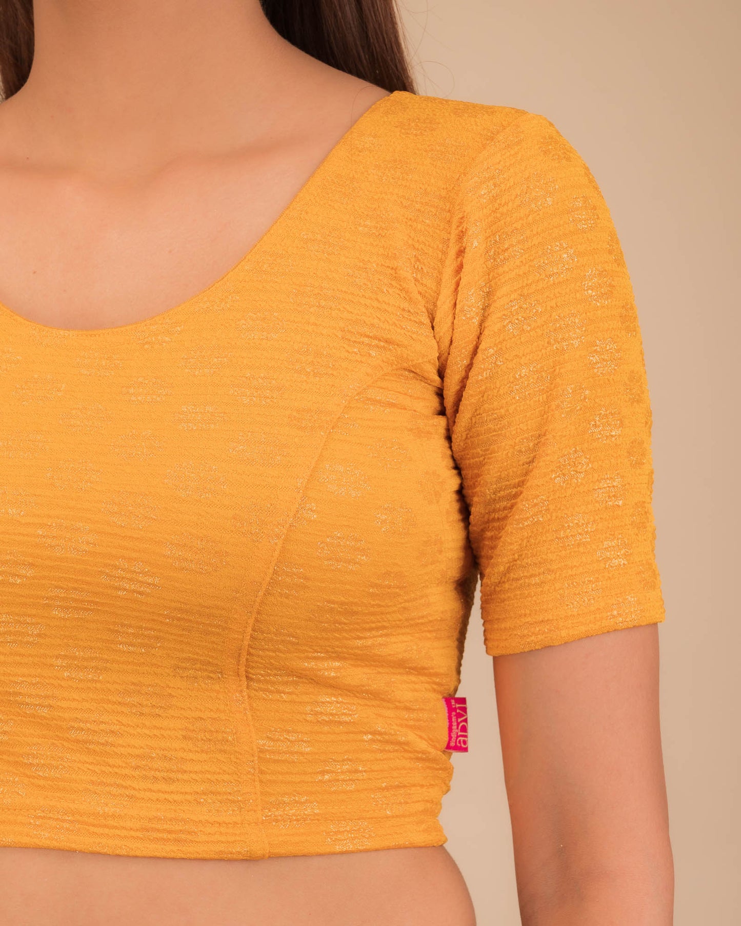 Close-up of jacquard knit with foil floral pattern.