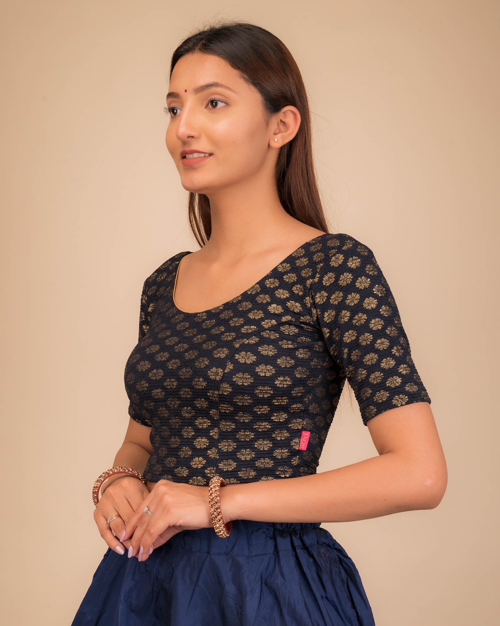 Side profile highlighting fit and sleeve structure.