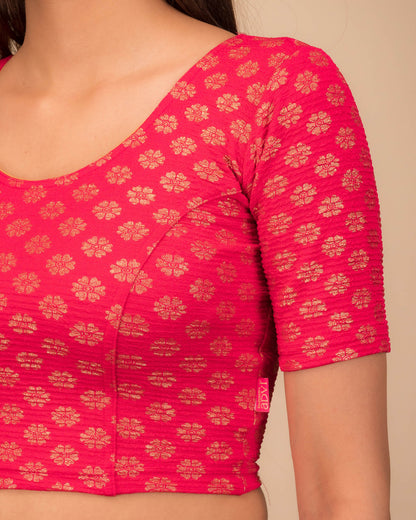 Close-up of jacquard knit with foil floral pattern.