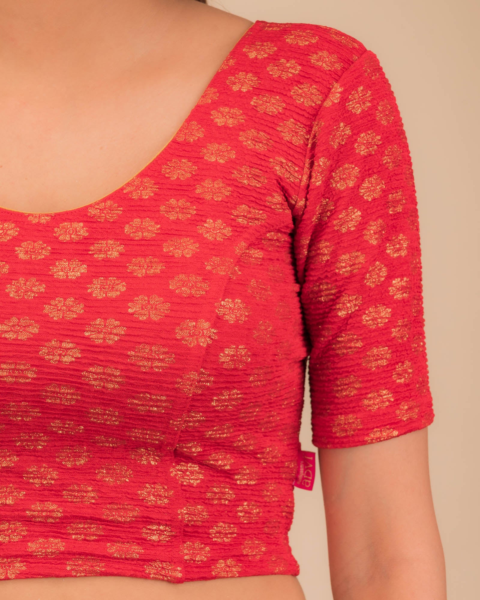 Close-up of jacquard knit with foil floral pattern.