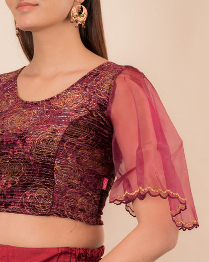 Close-up of velvet fabric and embroidered organza sleeve.