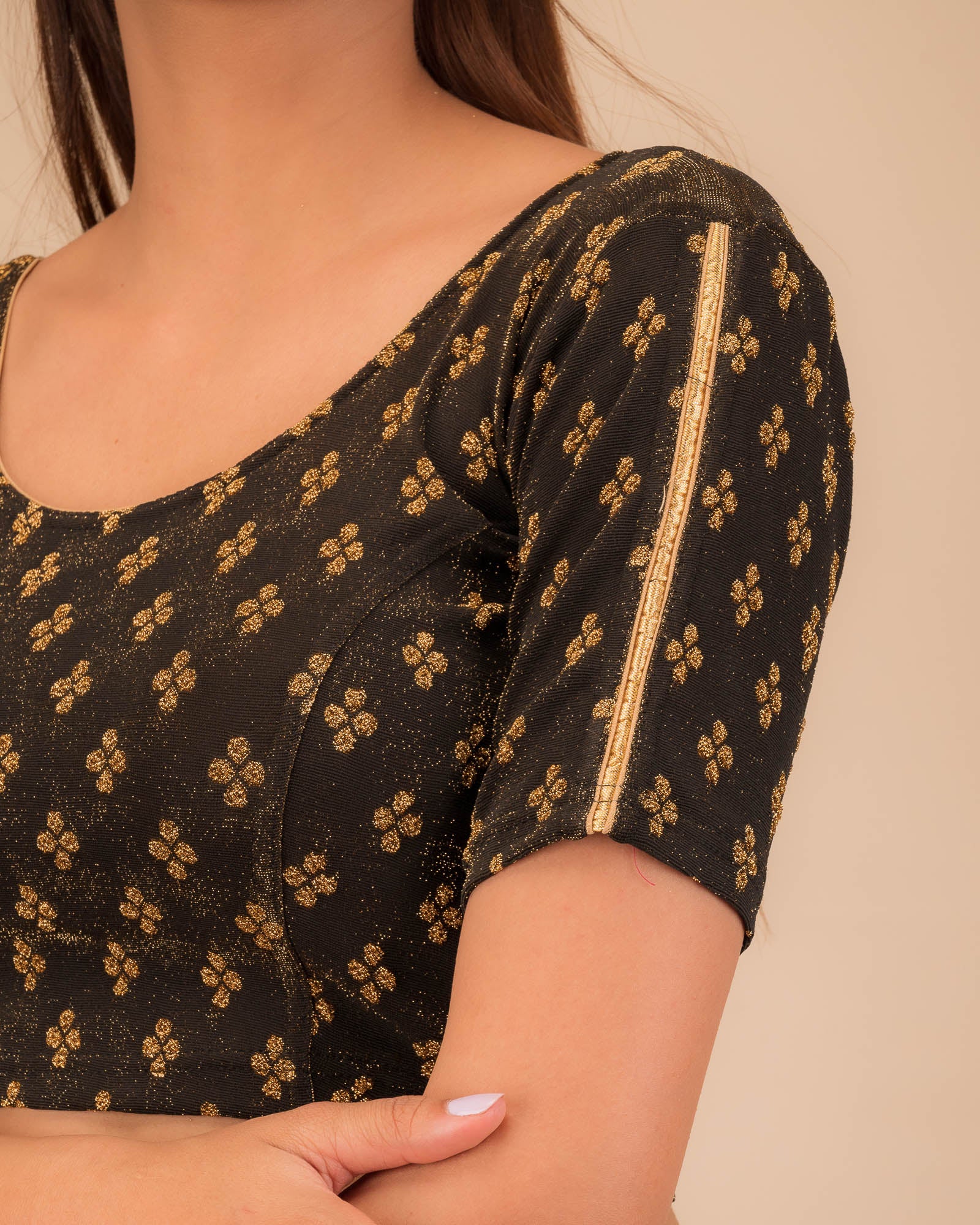 Close-up of jacquard fabric and motif detailing.