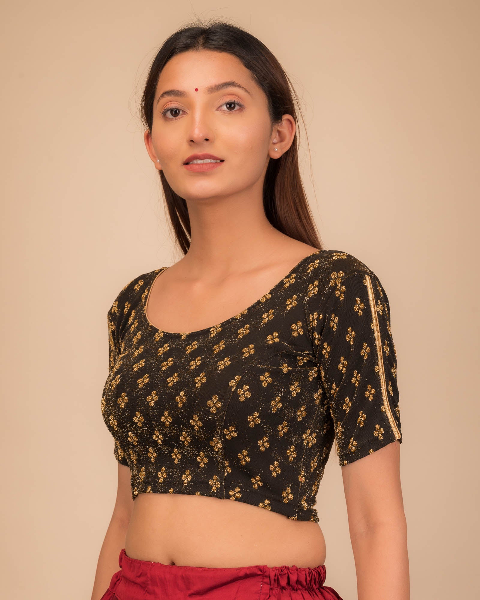 Side profile emphasizing the blouse’s fit and sleeve structure.