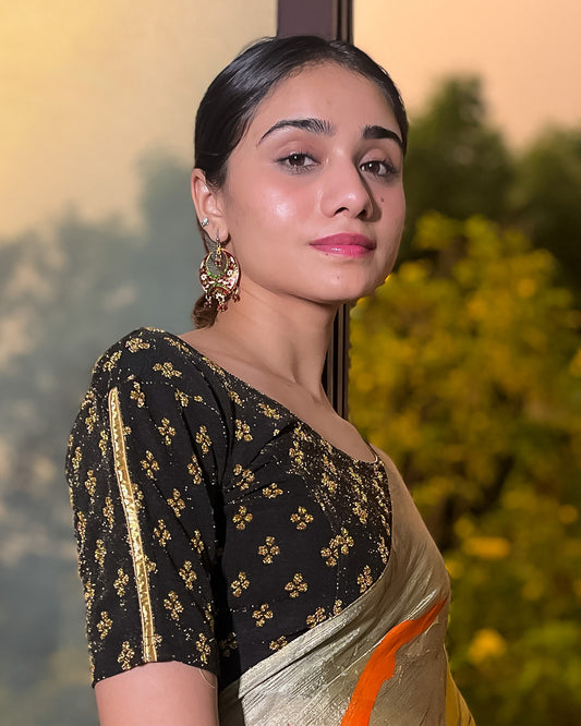 Model pairing the blouse with a saree for a traditional look.