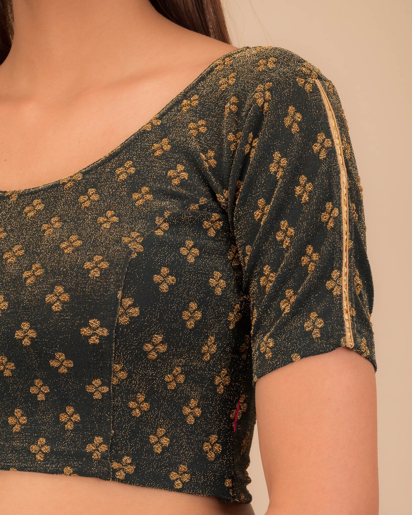 Close-up of jacquard fabric and motif detailing.