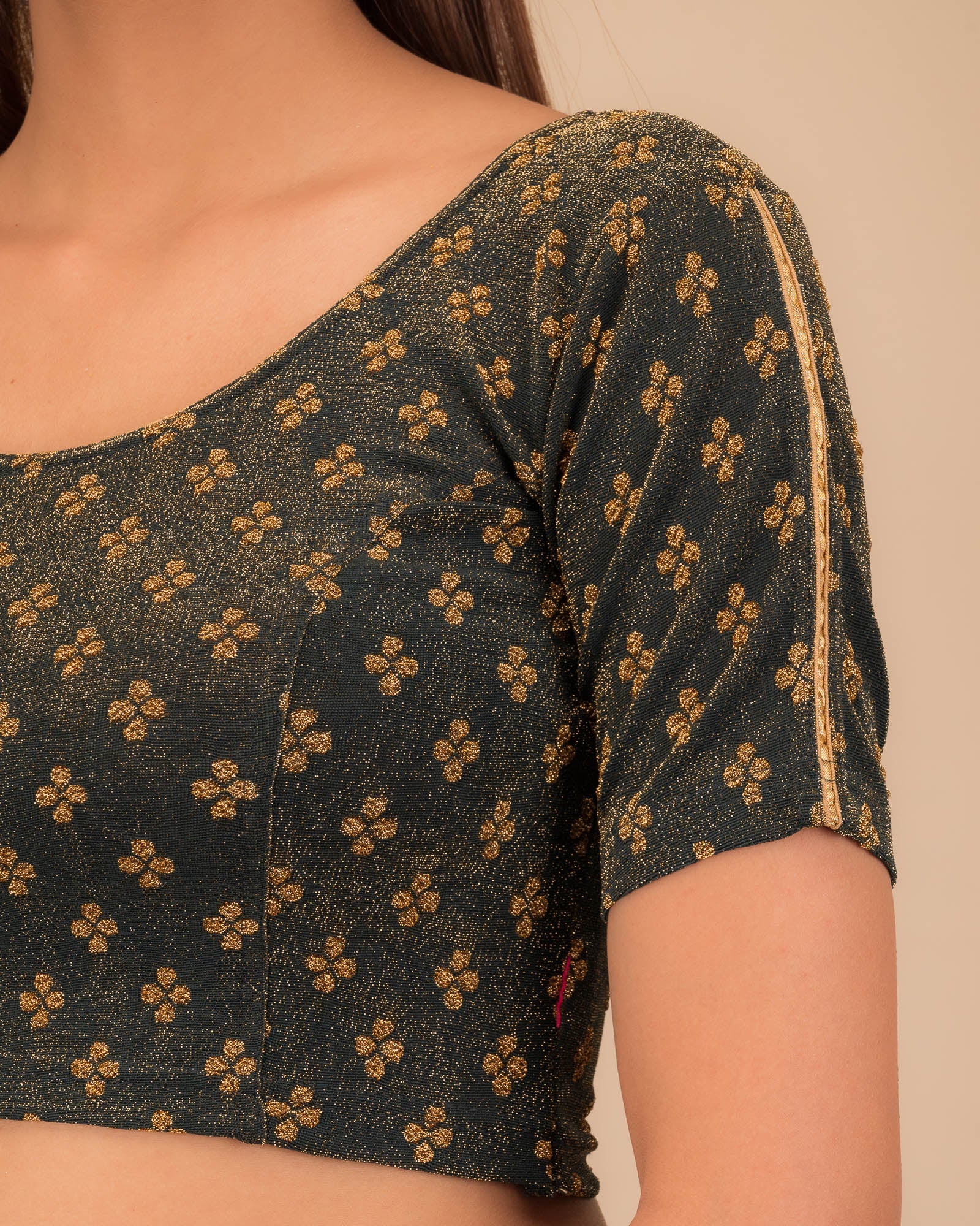 Close-up of jacquard fabric and motif detailing.