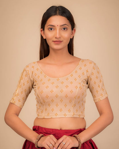 Model wearing a stretchable blouse with elbow sleeves and round neckline, showcasing buti motifs.