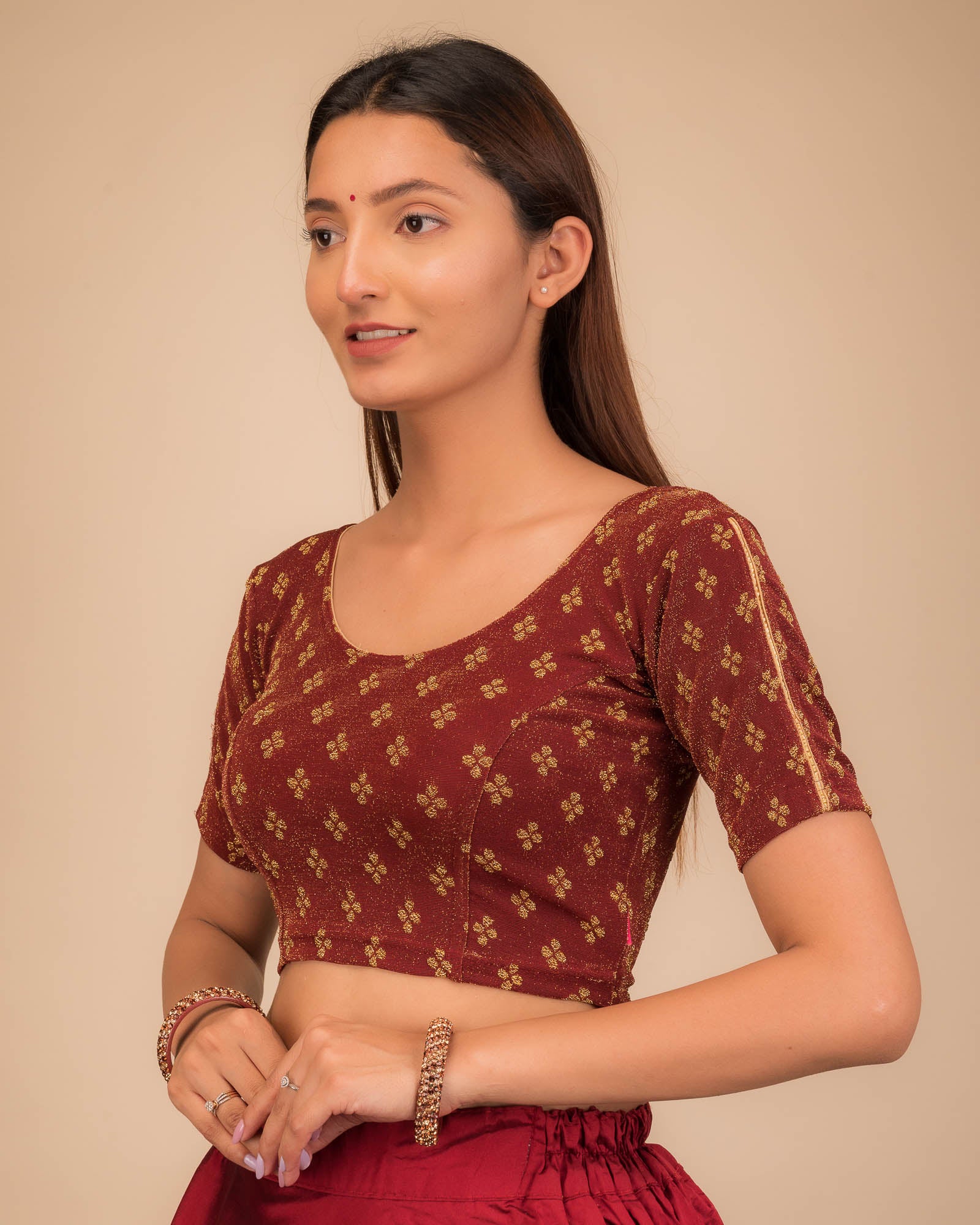 Side profile emphasizing the blouse’s fit and sleeve structure.