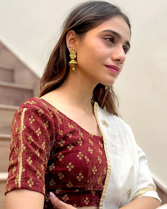 Model pairing the blouse with a saree for a traditional look.