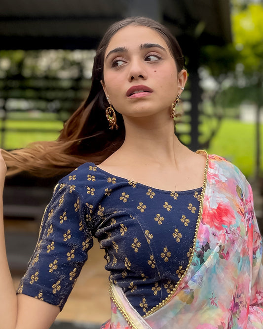 Model pairing the blouse with a saree for a traditional look.