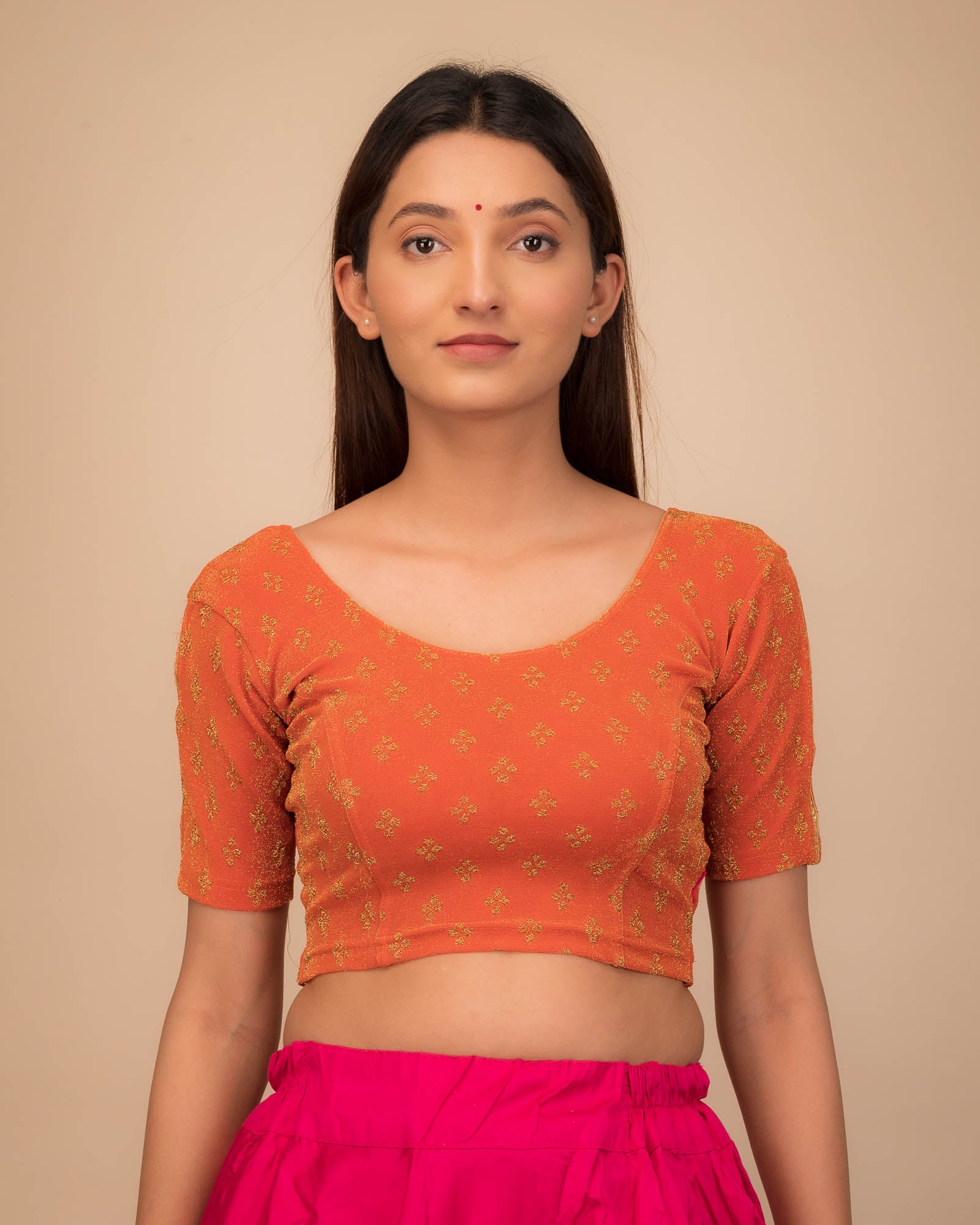 Model wearing a stretchable blouse with elbow sleeves and round neckline, showcasing buti motifs.