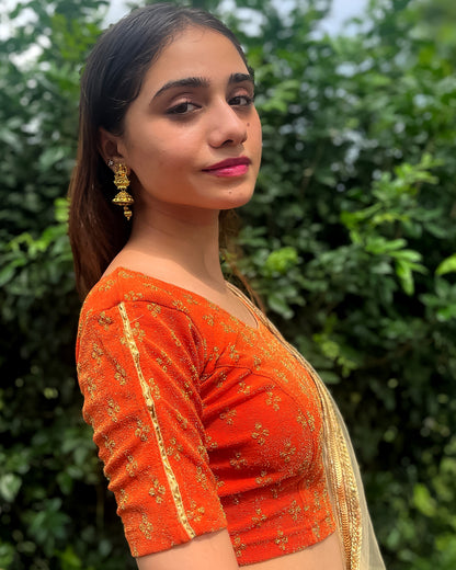 Model pairing the blouse with a saree for a traditional look.