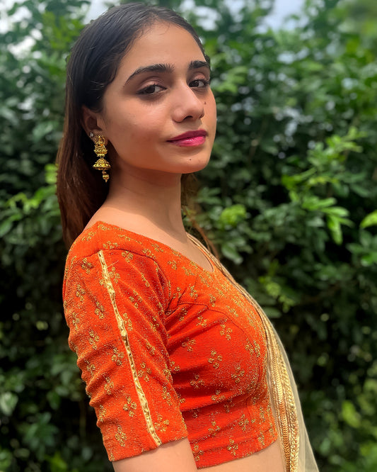 Model pairing the blouse with a saree for a traditional look.