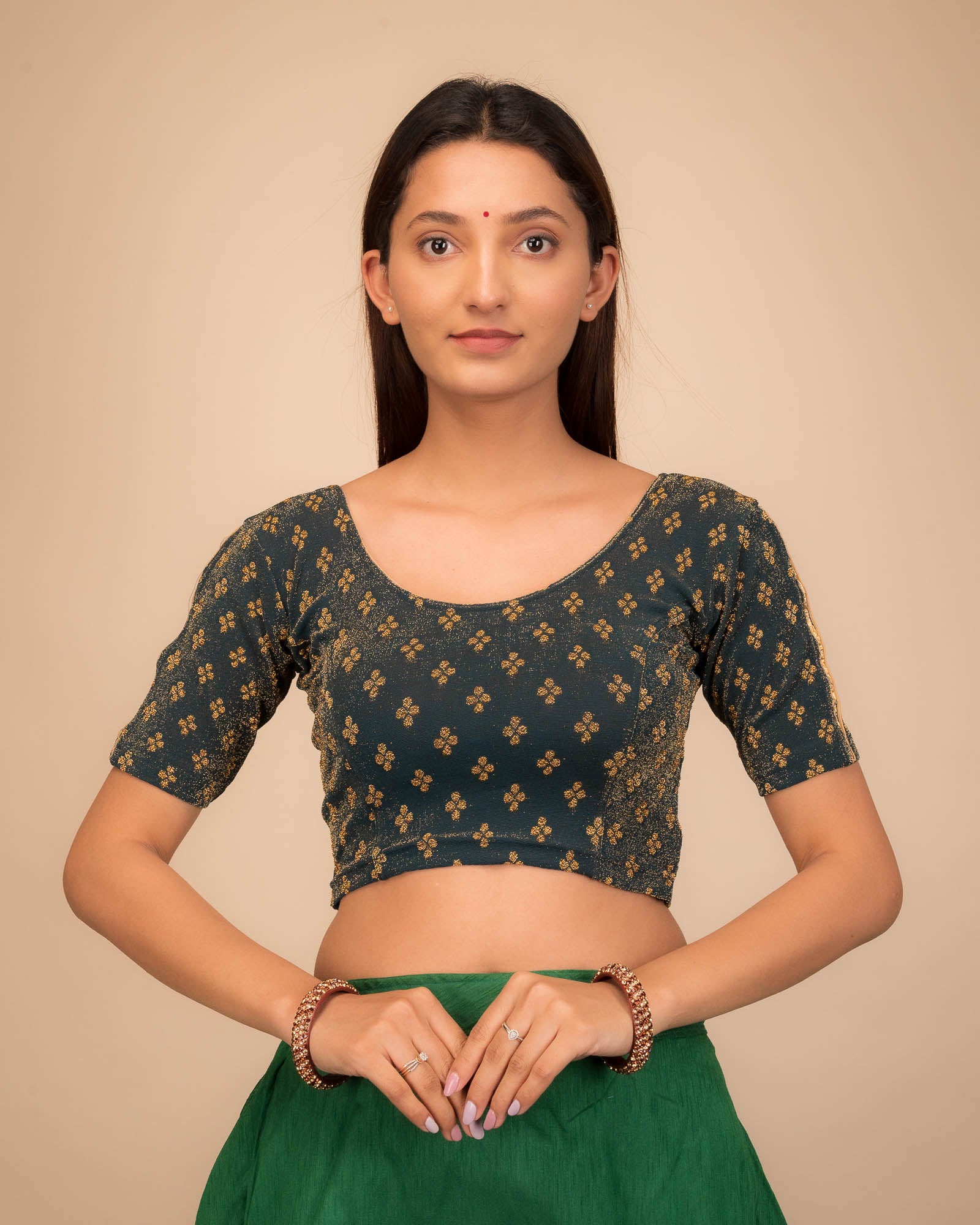 Model wearing a stretchable blouse with elbow sleeves and round neckline, showcasing buti motifs.