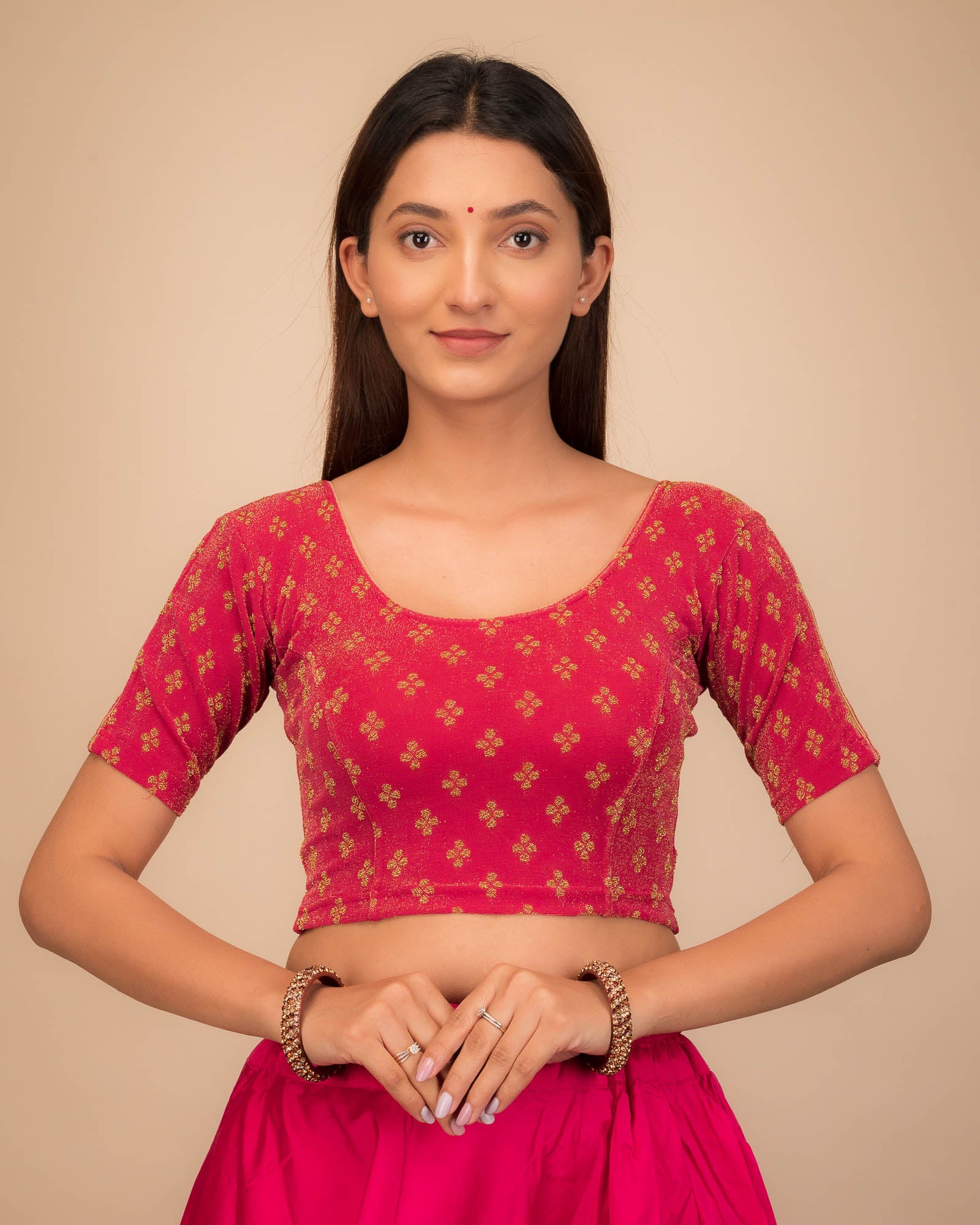 Model wearing a stretchable blouse with elbow sleeves and round neckline, showcasing buti motifs.
