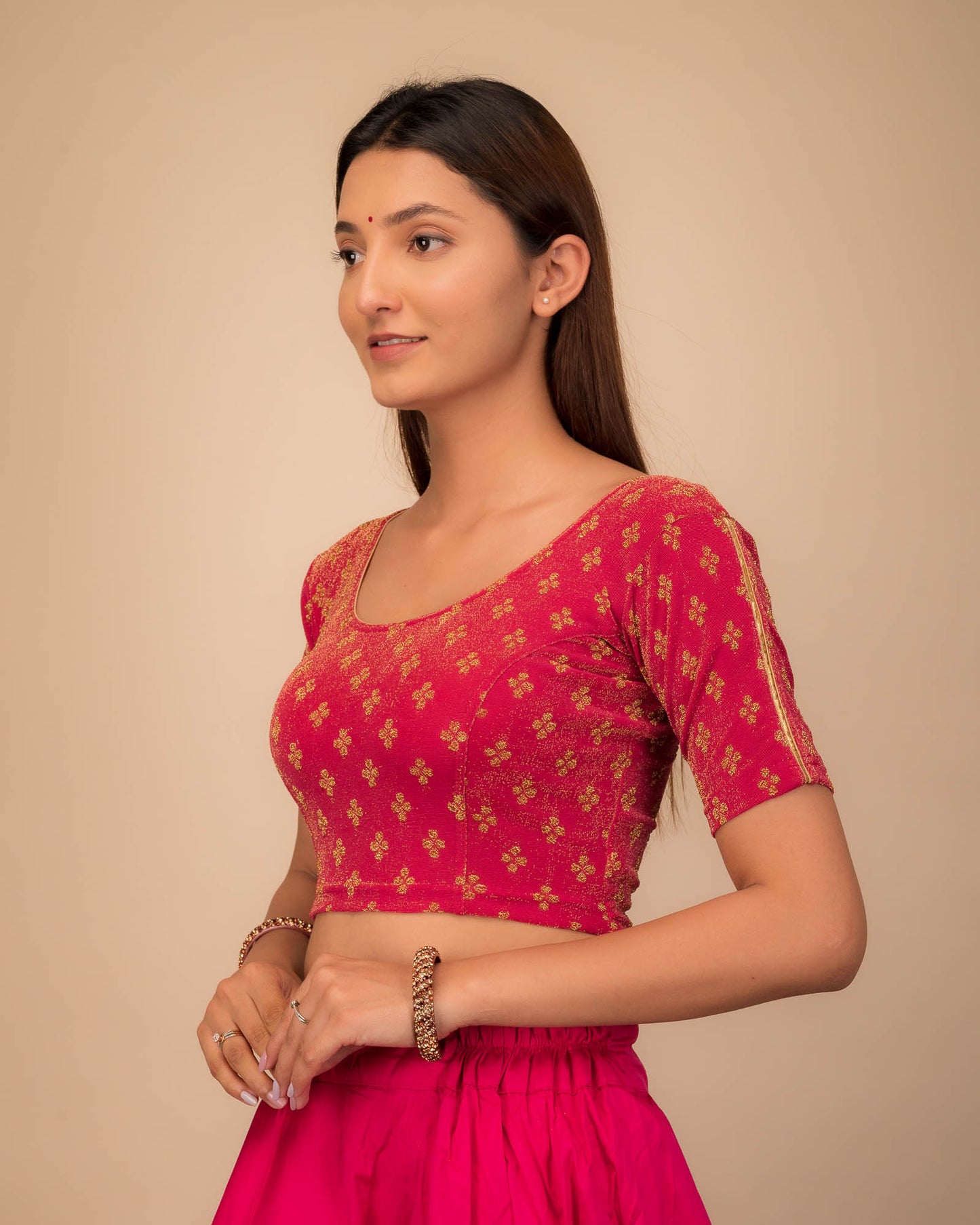 Side profile emphasizing the blouse’s fit and sleeve structure.