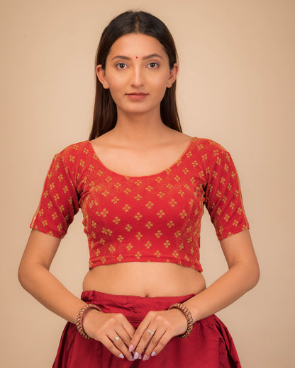 Model wearing a stretchable blouse with elbow sleeves and round neckline, showcasing buti motifs.
