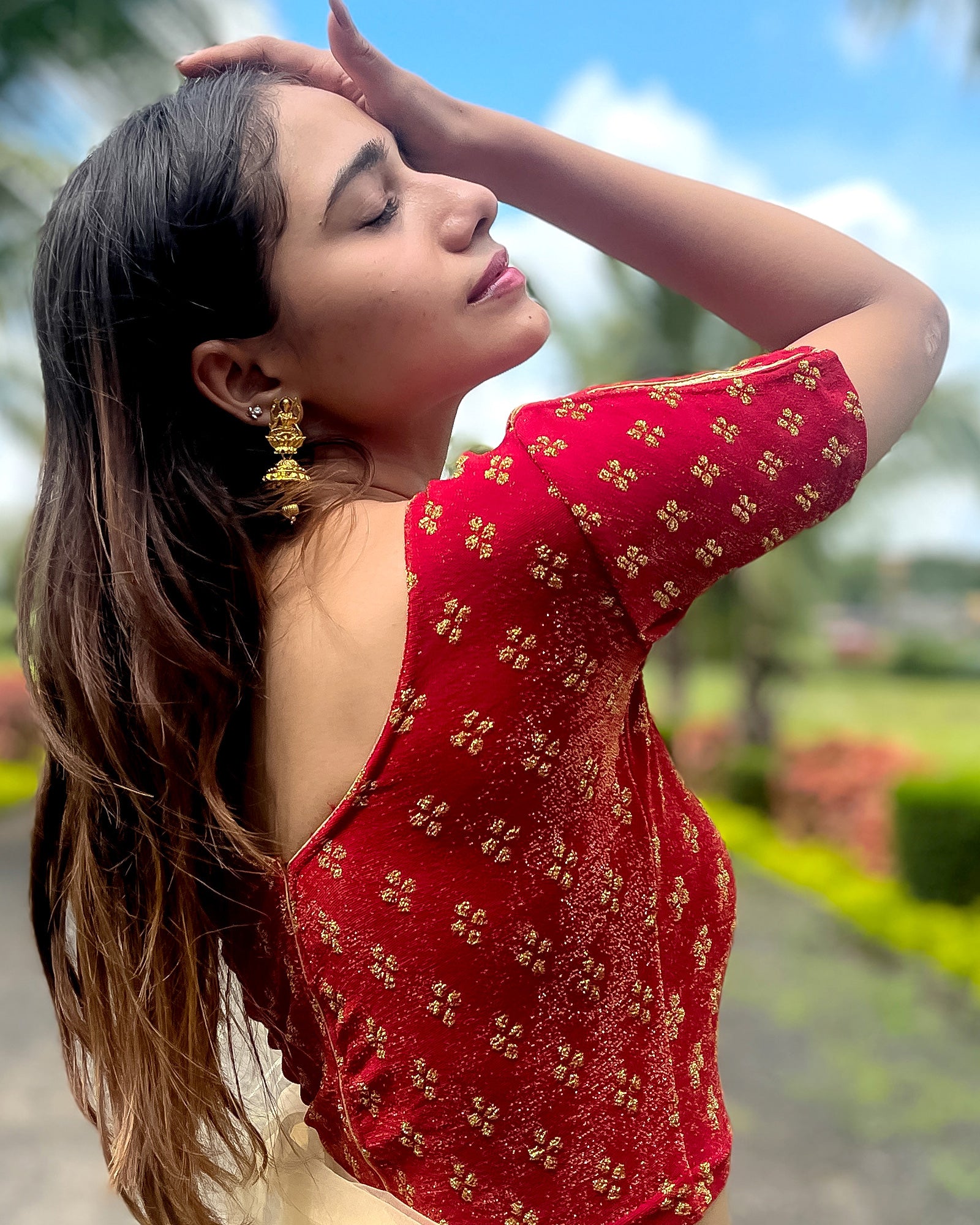 Model pairing the blouse with a saree for a traditional look.