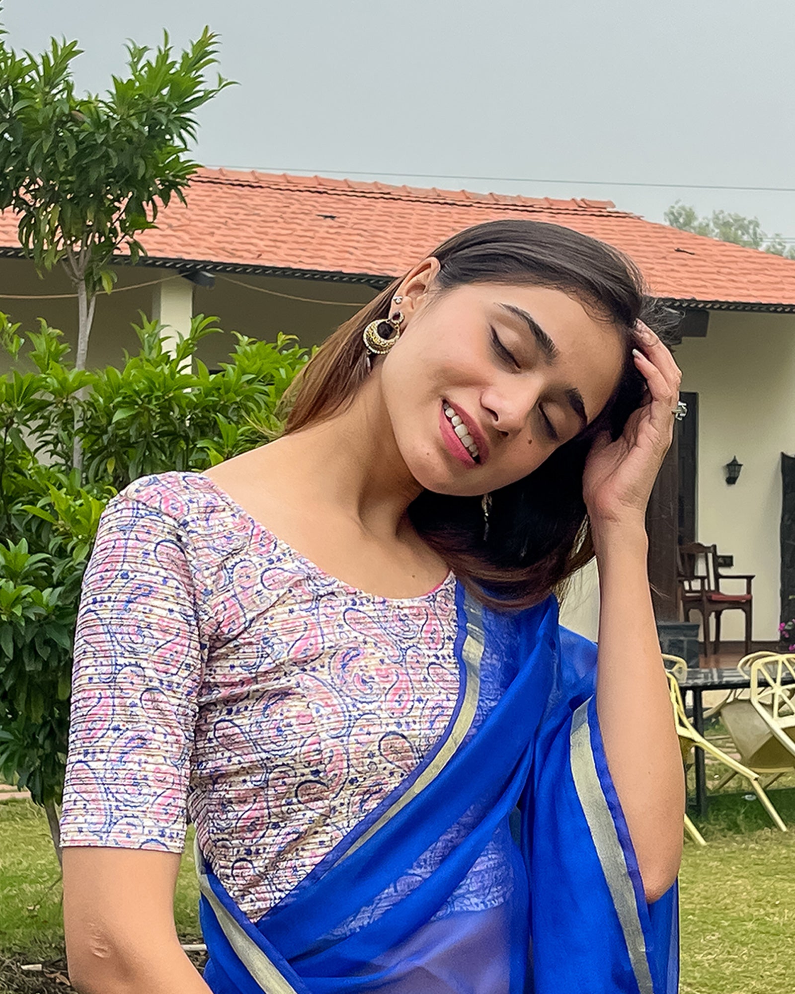 Model pairing the blouse with a saree for a festive-ready look.