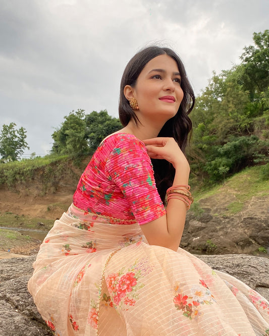 Model pairing the blouse with a saree for a festive-ready look.